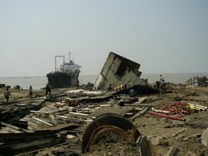 The seashore after a ship has been dismantled. There is a negative impact on the environment from waste oil, asbestos and other harmful materials